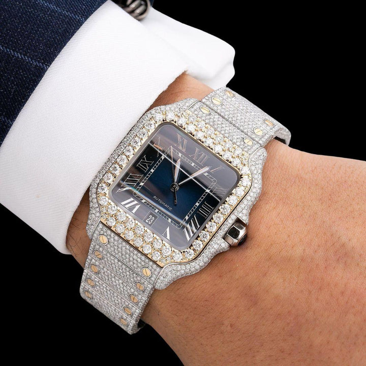 Cartier Santos Blue Dial White Roman Numerals Two Tone Yellow Gold Moissanite Watch On Wrist View